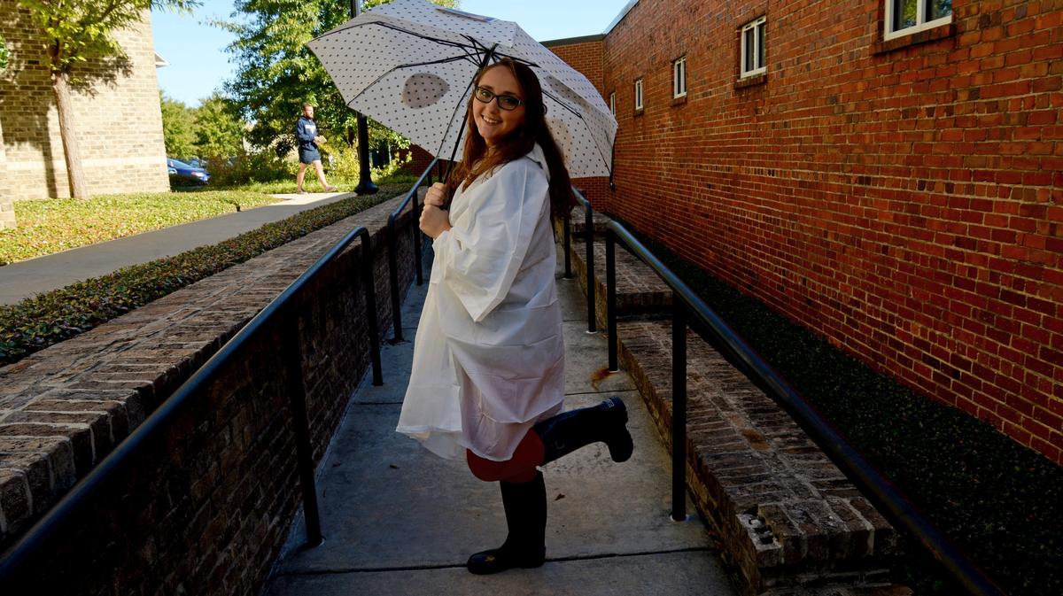 Jenna Eason, a reporter with The Macon Telegraph, models a halloween costume called “It’s raining men.”