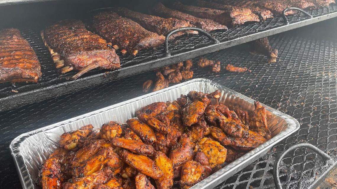 Levi’s Grill, a popular barbecue spot inside a convenience store and gas station at the corner of Old Perry Road and Ga. 96 in Houston County, serves up a variety of barbecue meats cooked on a grill in the parking lot.