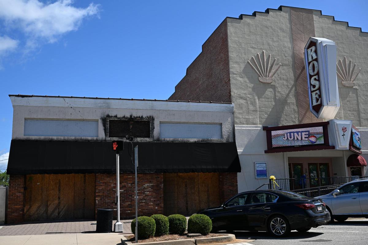 The Rose Theater sits next to what was once the Branded Star Boutique on Monday, June 16, 2025, in Forsyth, Georgia. The fire started at the Branded Star Boutique in August 2024, causing the theater to sustain smoke and water damage and start renovations in December 2024.