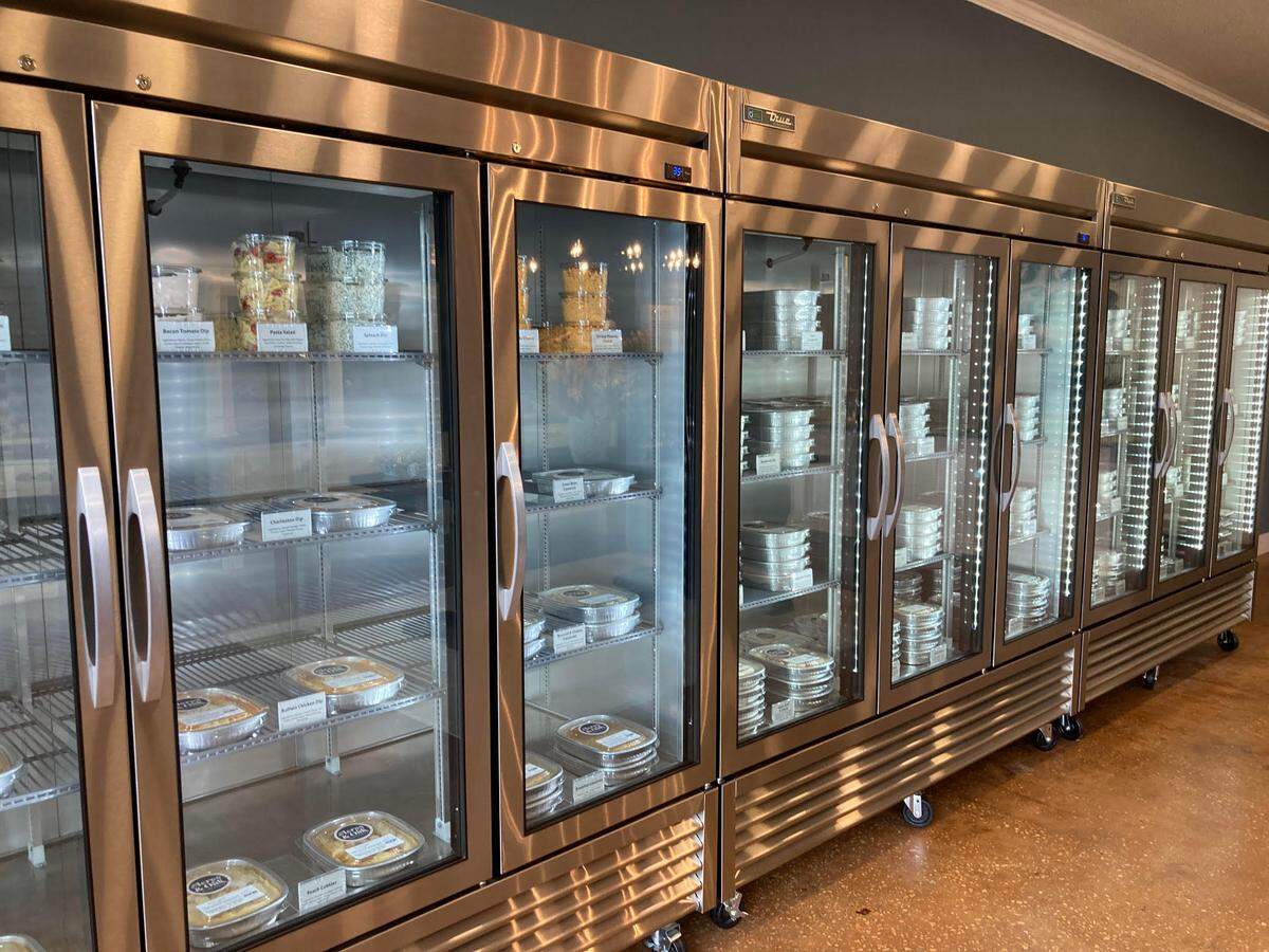 Ready to bake, family-style casseroles, desserts and appetizers fill these refrigerators and freezers at Acres & Oak Kitchen in Perry. The franchise owners of the Perry location are opening an Acres & Oak Kitchen in Warner Robins.