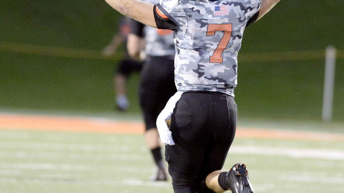 Mercer quarterback John Russ (7) celebrates a long touchdown pass to Jimmie Robinson the Bears' win over Chattanooga on Saturday.