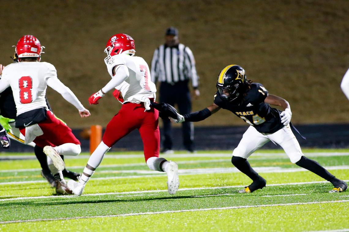 Trojan #14 Brandon Respress grabs the Savanannah ball carrier to save a touchdown early in the first. Special to Telegraph by Donn Kester 11/18/2022