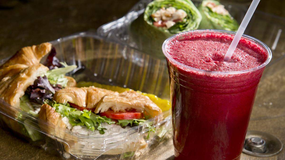 JASON VORHEES/THE TELEGRAPHA chicken salad croissant and smoothie made with apple, pear, carrot, red cabbage, beet, pineapple, lemon and cucumber are among the menu options at Wild Organics Juice Company in Bonaire.