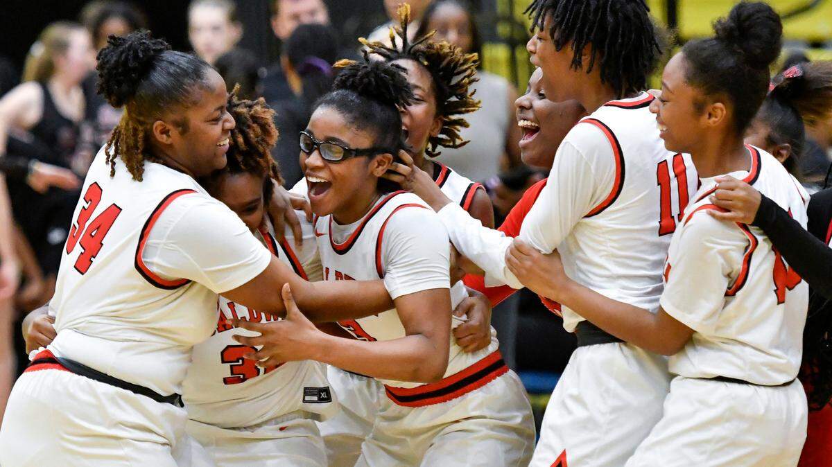 Baldwin players celebrate their 58-45 GHSA 4A semifinal win over Holy Innocents’ Saturday at Fort Valley State. Baldwin will play Griffin Wednesday, March 8 at 5 p.m. at the Macon Coliseum.