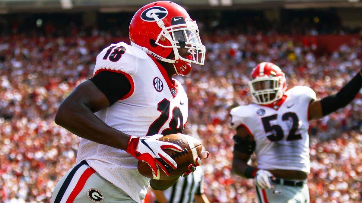 Georgia defensive back Deandre Baker (18) leads a break away to score Georgia’s first touchdown during a college football game between The University of Georgia and The University of South Carolina in Williams-Brice Stadium in Columbia, S.C. on Sept., 8, 2018.