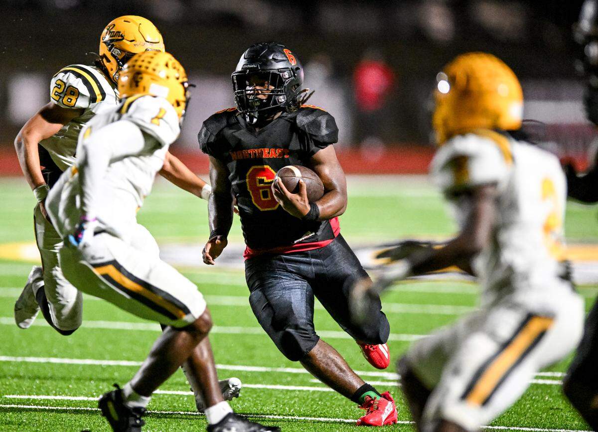 Northeast Raider running back Nick Woodford cuts through three Worth County defenders and heads to the endzone for touchdown in action Friday at Thompson Stadium in Macon.