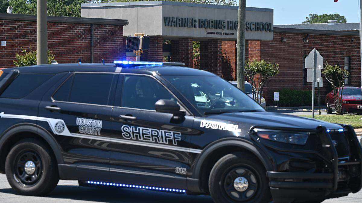 A Houston County Sheriff’s Office patrol car sits blocking South Davis Drive on Monday, May 18, 2026, outside of Warner Robins High School in Warner Robins, Georgia. The Houston County Sheriff’s Office blocked roads outside the high school after a bomb threat was called in Monday afternoon. 