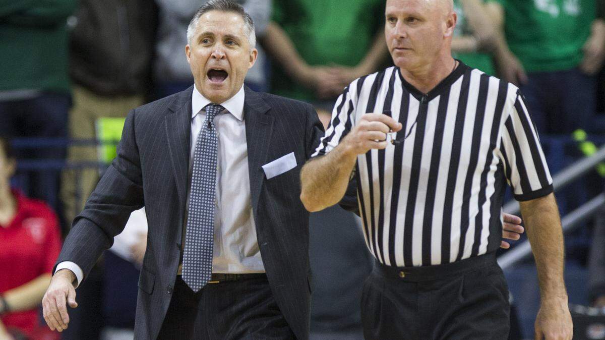 Georgia Tech head coach Brian Gregory talks to an official during the first half of an NCAA college basketball game, Wednesday, Jan. 13, 2016, in South Bend, Ind. (AP Photo/Robert Franklin)