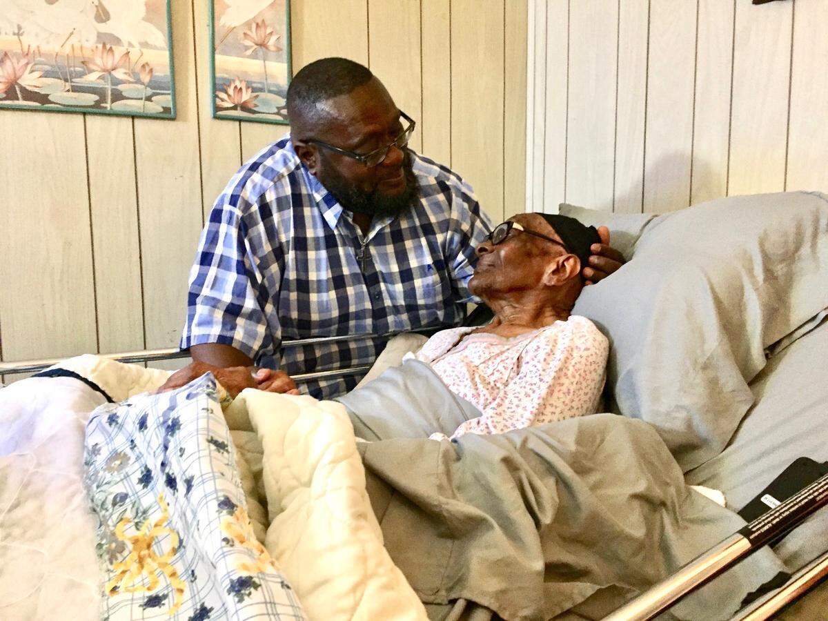 Tony Mathis recently moved back into the house where he was raised on Kings Park Circle to care for his ailing 102-year-old grandmother, Fannie Mae Smith. He has fond memories of his childhood in Kings Park, but worries about his grandmother’s safety in the increasingly dangerous neighborhood.
