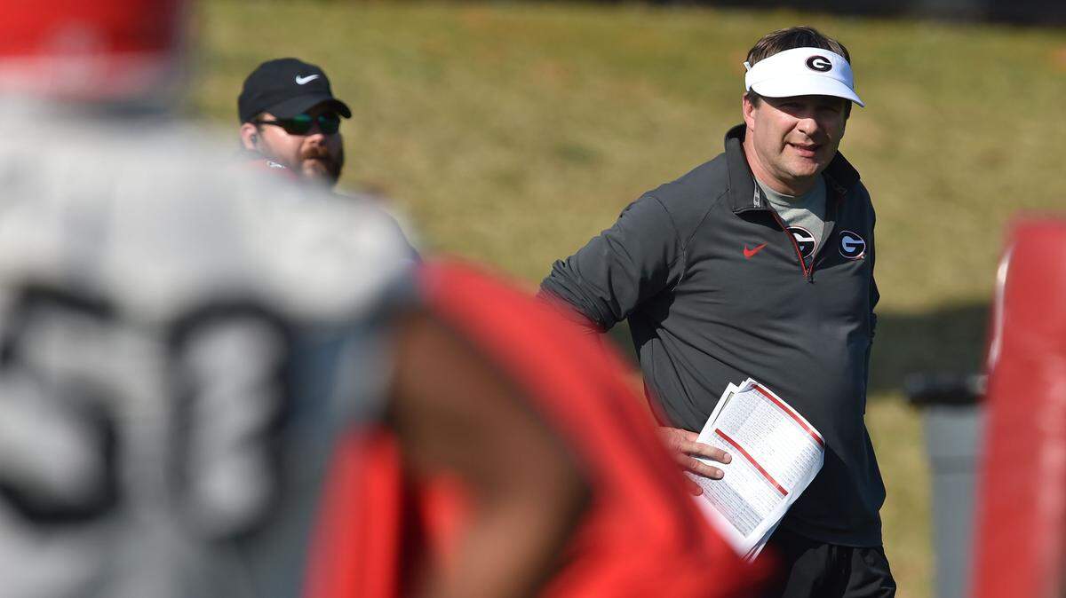 Georgia's new head football coach Kirby Smart watches his team during the first day of spring NCAA college football practice, Tuesday March 15, 2016, in Athens, Ga. (Brant Sanderlin/Atlanta Journal-Constitution via AP)