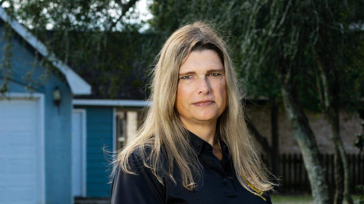 Houston County Sgt. Anna Lange outside her home. Lange sought at exclusion to the county’s health insurance policy to cover surgeries needed to make her body align with her gender. County leaders refused, and spent $1 million in court fighting Lange.