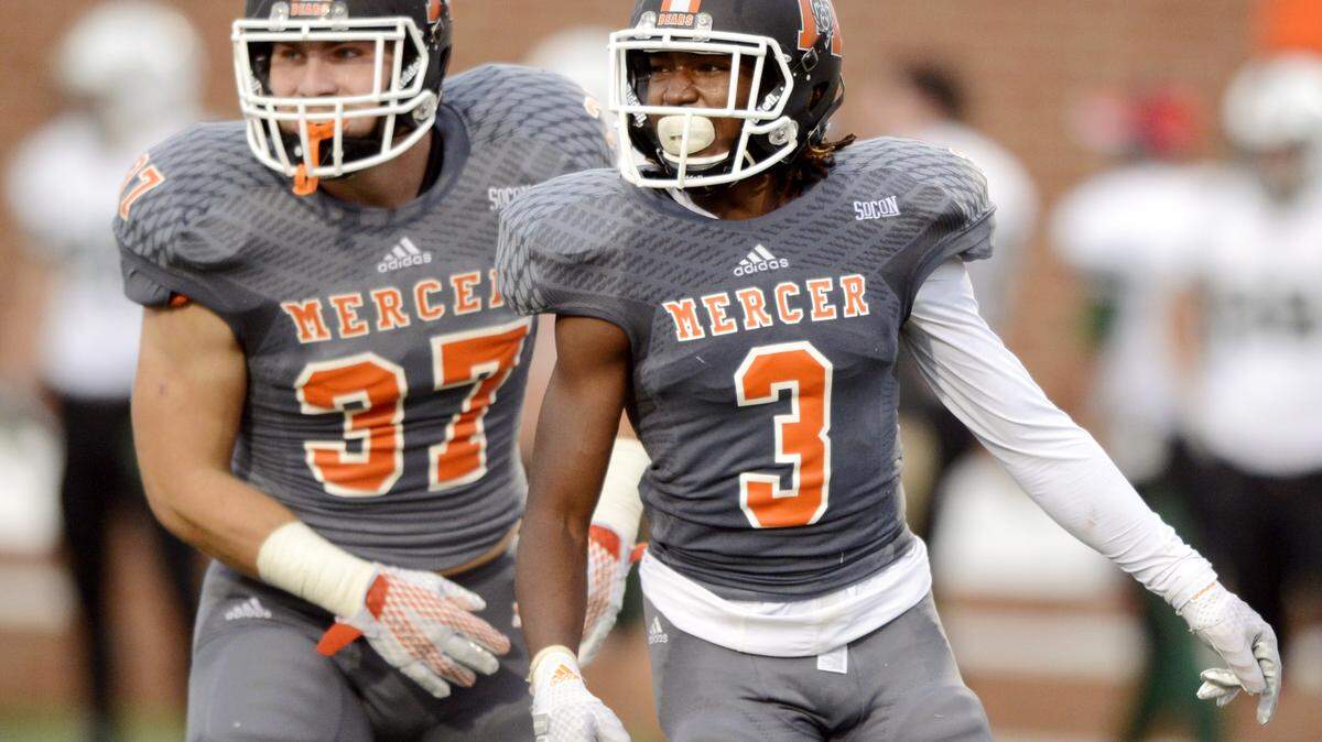 Mercer defensive back Stephen Houzah (3) heads back to the bench after an interception during the Bears’ game against Stetson Saturday.
