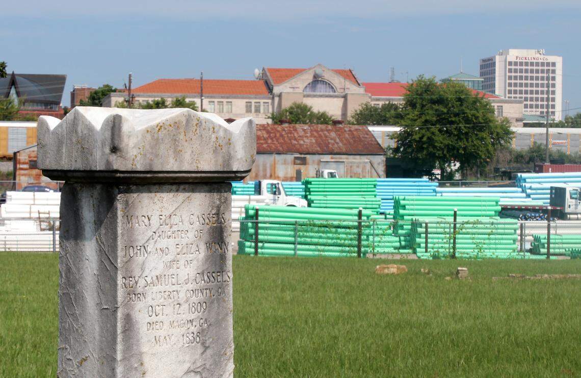 A restored tombstone in the old Macon City Cemetery, which is now surrounded by industrial businesses.