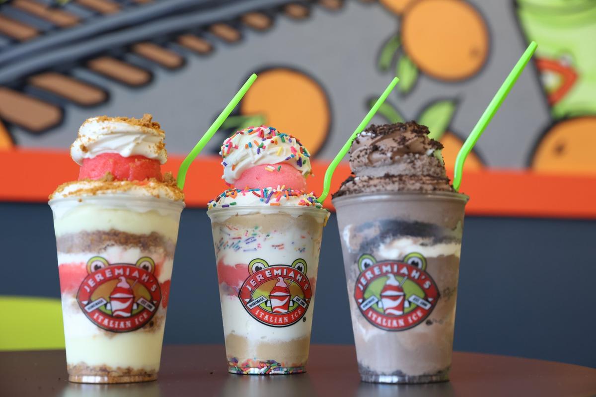 From left to right: frosted animal cracker, birthday cake and oreo mud pie gelati, which layers Italian ice and soft serve, sit on a table inside of Jeremiah’s Italian Ice on Wednesday, Nov. 20, 2024, in Centreville, Georgia. A new Jeremiah’s Italian Ice location is expected to open in Macon in March 2025, following existing locations in Centreville, Warner Robins and Perry.