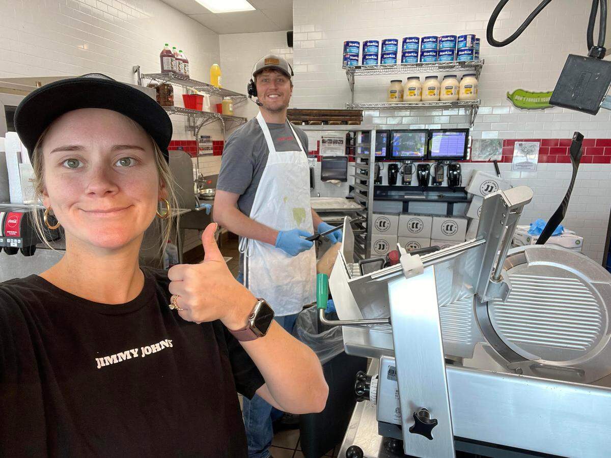 Alex Amos, on her day off, helps out her husband, William Amos in the background, and the Jimmy John’s team in Tifton “get back open after some hurricane interruptions last year,” William Amos said.