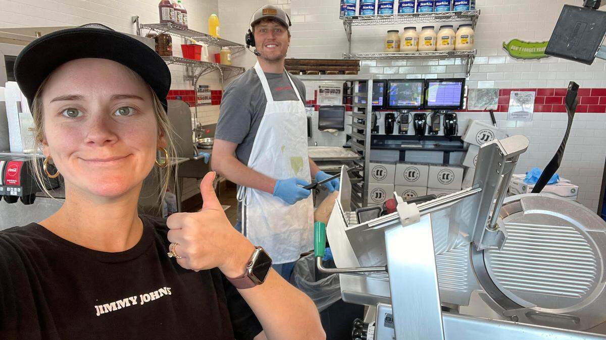 Alex Amos, on her day off, helps out her husband, William Amos in the background, and the Jimmy John’s team in Tifton “get back open after some hurricane interruptions last year,” William Amos said.