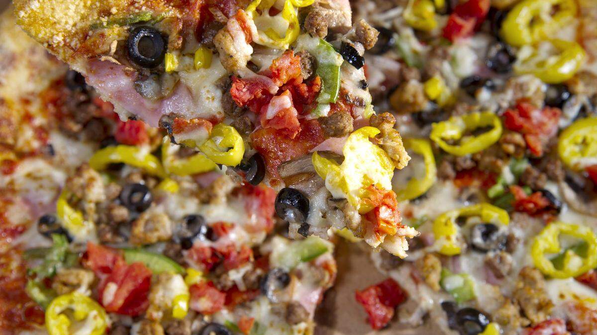 The Big Kahuna pizza at Macon Pizza Company features pepperoni, ham, onions, mushrooms, green peppers, Italian sausage, ground beef, black olives, diced tomatoes and banana peppers.