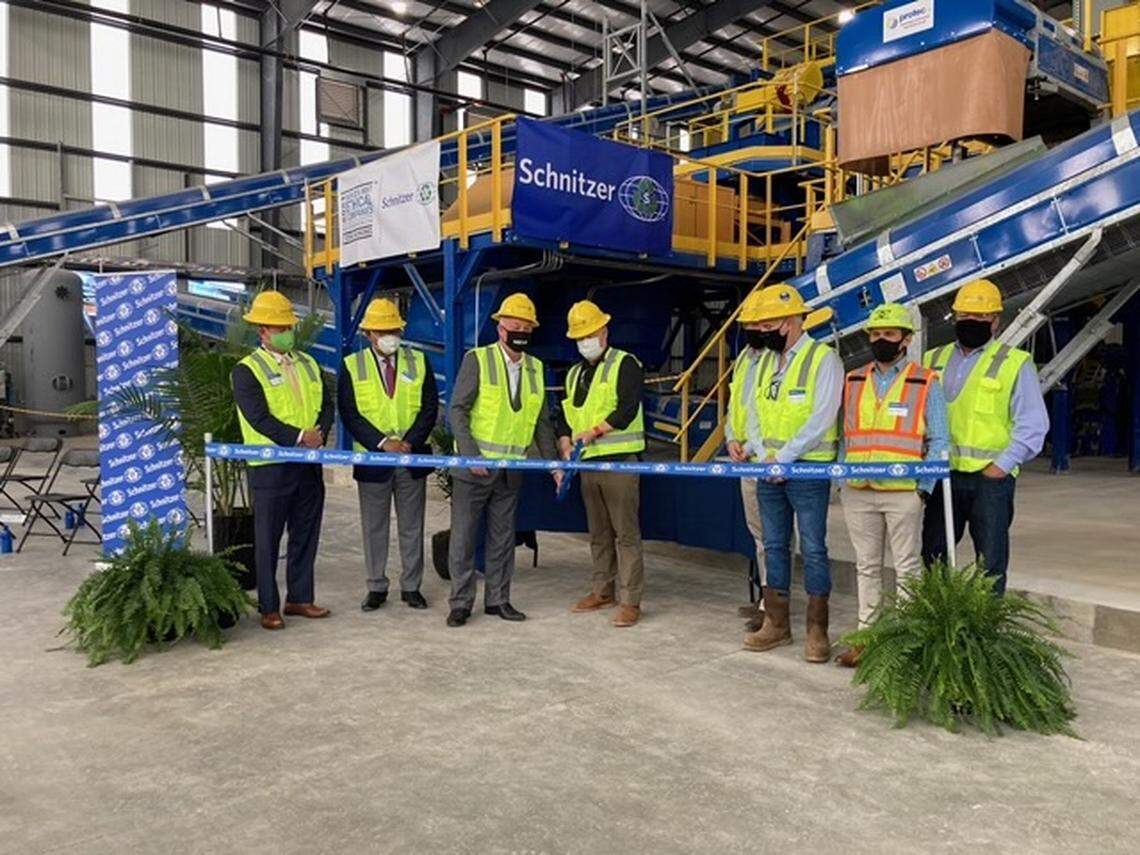 Ribbon-cutting ceremony for a new Advanced Aluminum Separation System at Schnitzer Steel Industries location in Macon.