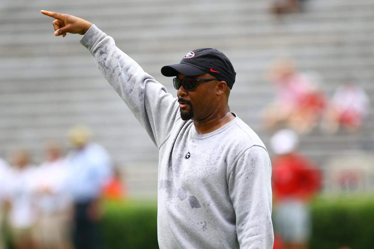 Georgia run game coordinator and running backs coach Dell McGee instructs players during the Bulldogs’ session in Sanford Stadium on Saturday, Aug. 10, 2019.
