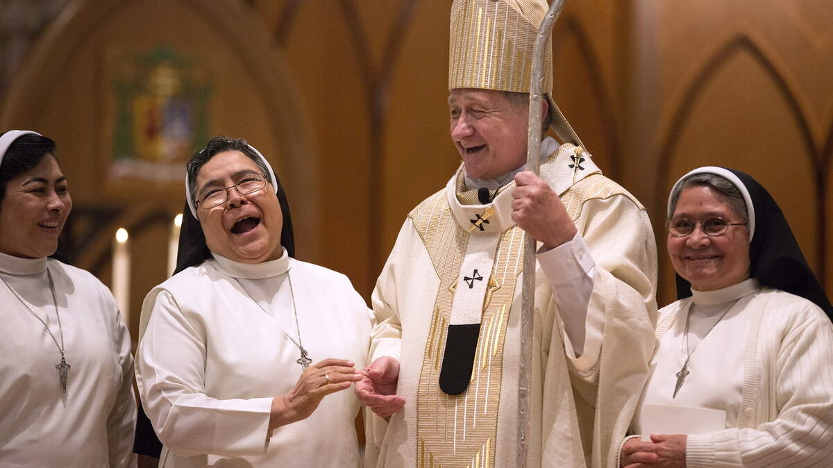 ERIN HOOLEY/CHICAGO TRIBUNEChicago Archbishop Blase Cupich laughs with a group of nuns after he was invested with a pallium, a woolen, scarf-like vestment recently blessed by Pope Francis at the Vatican, during Mass at Holy Name Cathedral last month in Chicago.