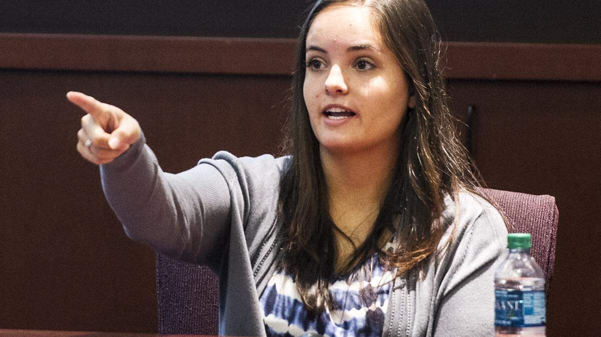 Kaylie Lopez points at William Lawrence Carpenter sitting at the defense table in the courtroom. Carpenter, 30, was indicted on one count of aggravated assault, one count of attempted kidnapping and two counts of possession of a firearm during a crime.