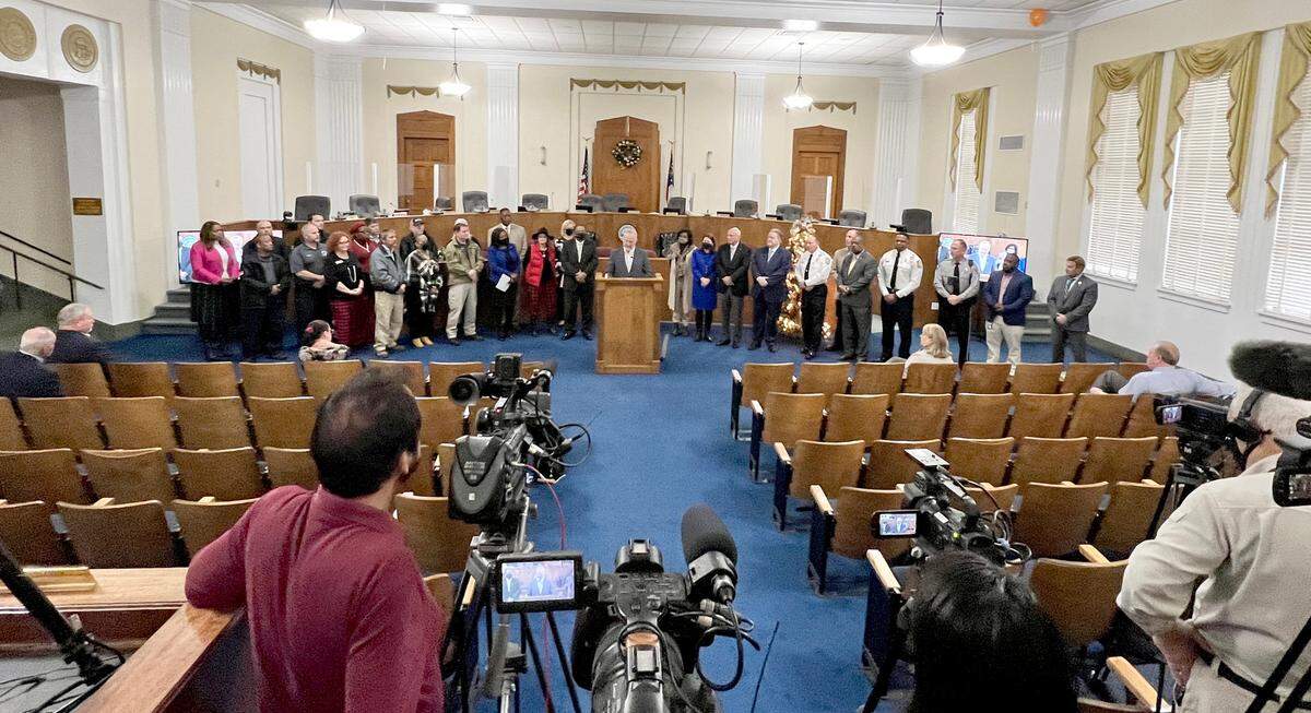 Macon-Bibb County Mayor Lester Miller, surrounded by community leaders announces the unveiling of the Macon Violence Prevention Strategic Plan Wednesday morning at City Hall.
