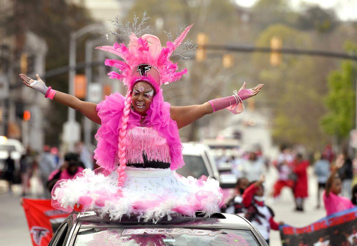 Carolyn ÒBirdLadyÓ Freeman poses for a picture along Mulberry Street Sunday during the 39th Annual Cherry Blossom Parade.