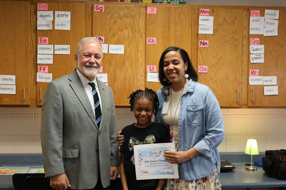 Georgia Superintendent Richard Woods informs Houston County elementary school teacher Jade Thomas with news that she has been selected as one of the state’s ten finalists for 2026 Teacher of the Year Award. Thomas teaches fourth grade at Lake Joy Elementary.