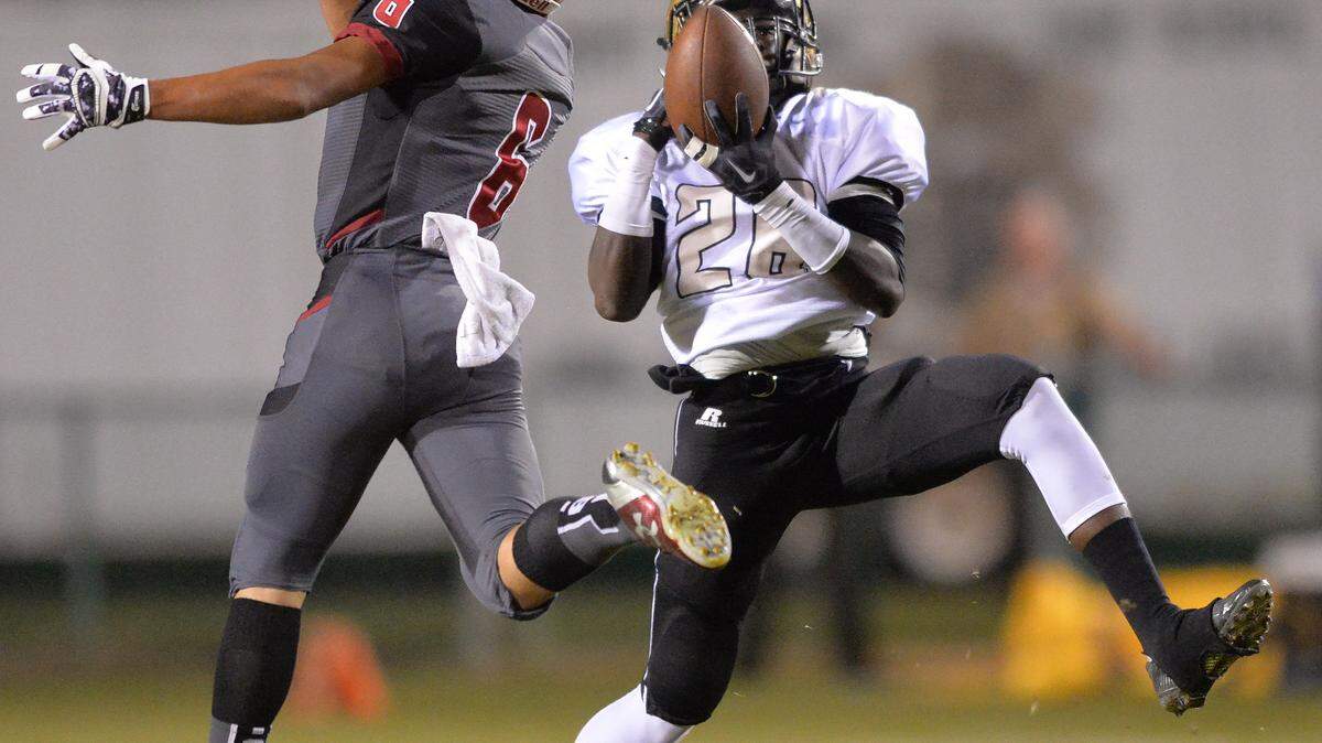 Mary Persons receiver Jatori Sims hauls in a pass from Jake Johnston and heads for an MP touchdown against Howard High Scholl Friday night in Macon.