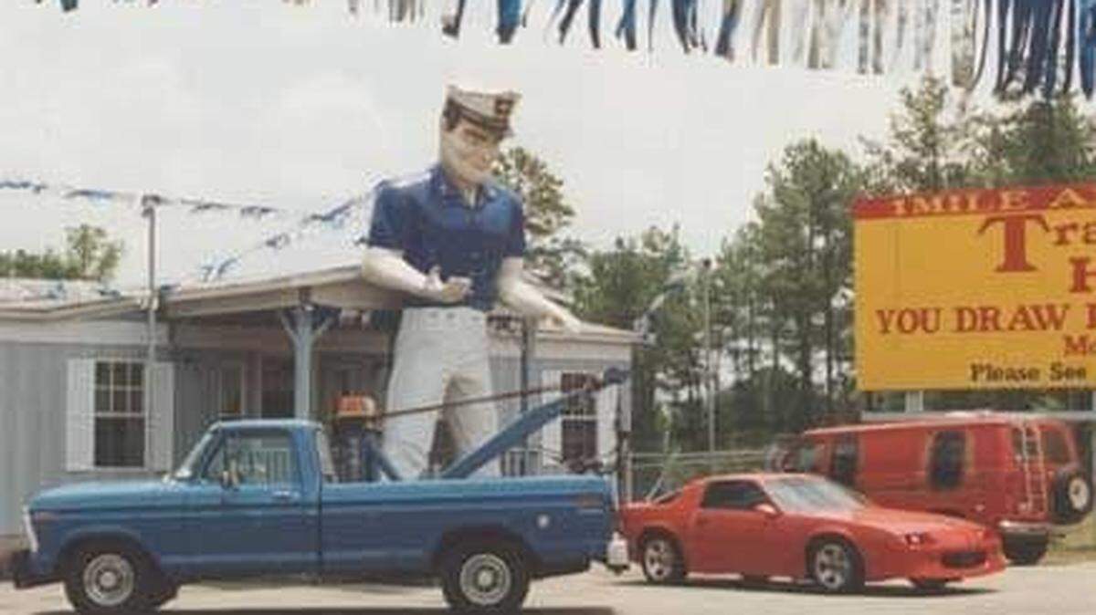 Long-lost Macon landmark, Mr. Finance Giant, was found in Jones County woods on March 14, 2024.