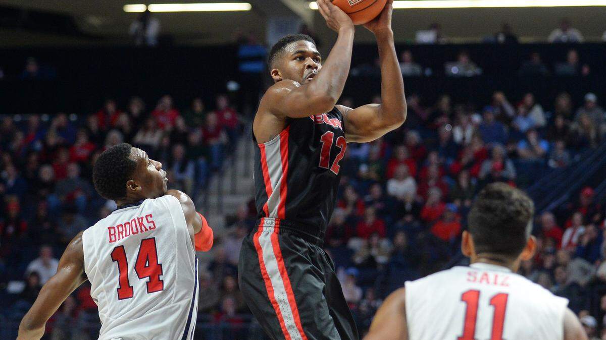 Georgia guard Kenny Gaines (12) shoots past Mississippi guard Rasheed Brooks (14) during the second half of an NCAA college basketball game in Oxford, Miss., Saturday, Jan. 9, 2016. Mississippi won 72-71. (AP Photo/Thomas Graning)
