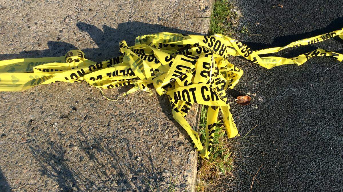Crime scene tape on the ground