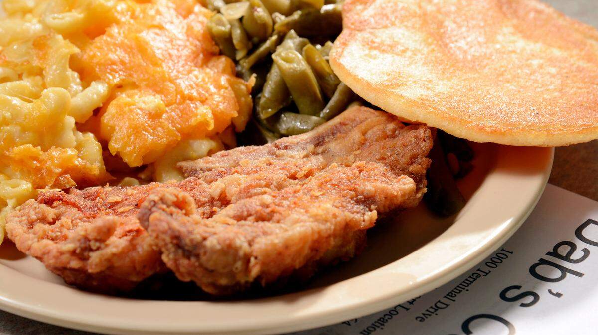 Fried pork chop with macaroni and cheese and green beans at Dab’s Cafe at the Middle Georgia Regional Airport.