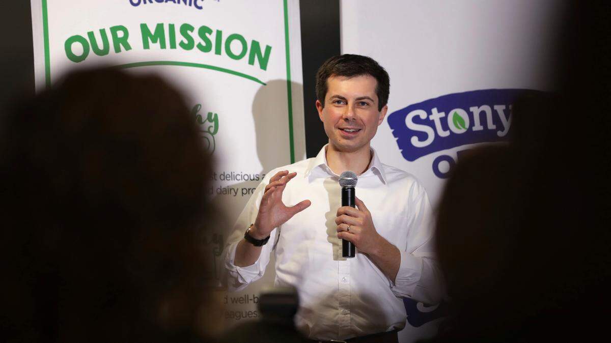 Democratic presidential candidate and South Bend, Ind., Mayor Pete Buttigieg answers questions from employees during a campaign stop at a dairy company in Londonderry, N.H., on Friday.