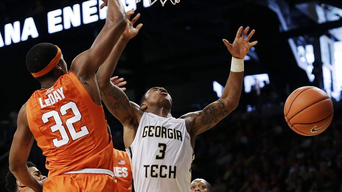 Georgia Tech's Marcus Georges-Hunt, right, is stripped of the ball by Virginia Tech's Zach LeDay during the second half of Saturday's game in Atlanta.