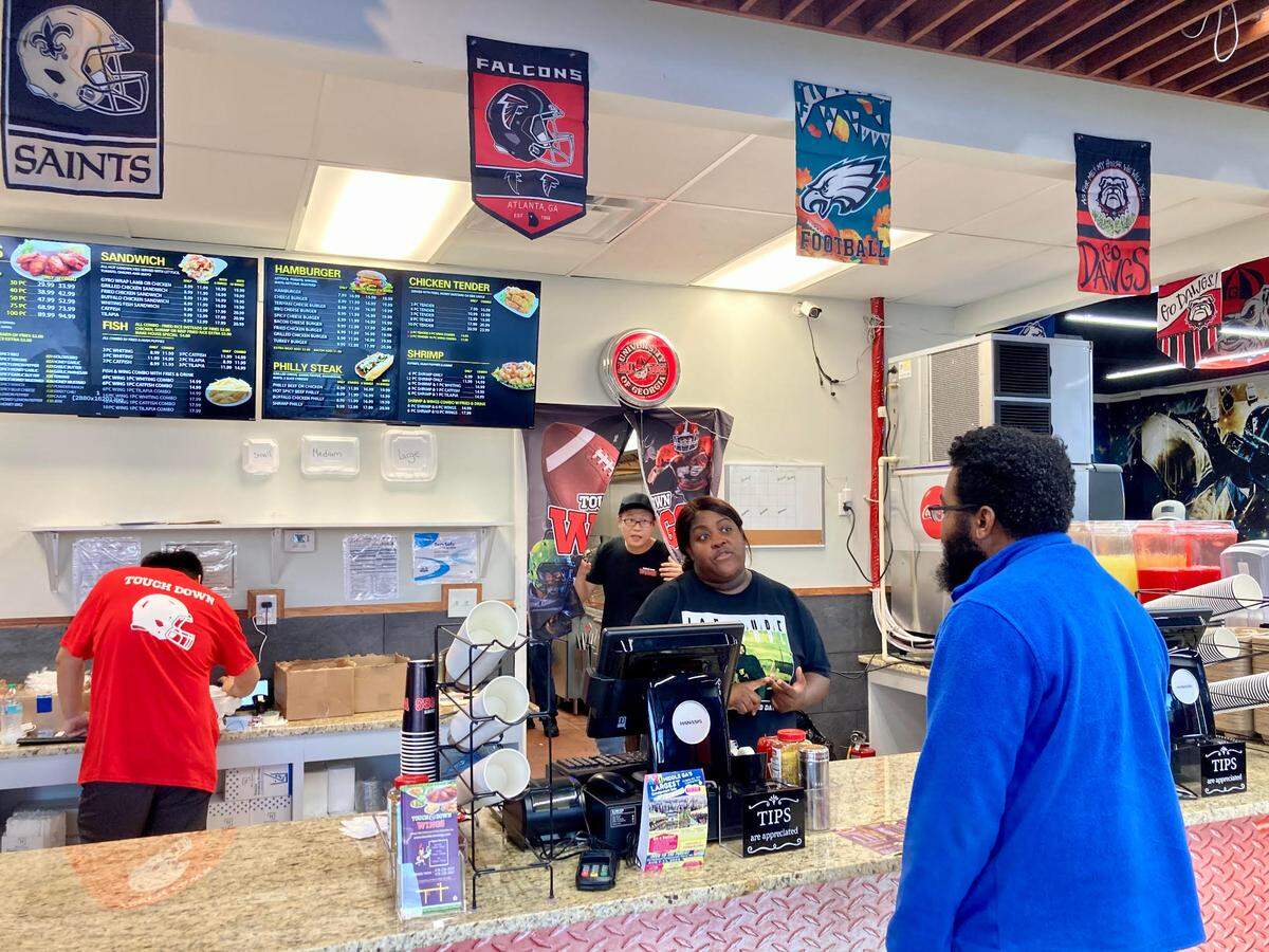 A customer places an order at this new Warner Robins location of this fast-growing restaurant chain known for its all natural organic chicken, 30 sauce flavors and host of other offerings such as Philly steak, hamburgers, fish and fried rice.