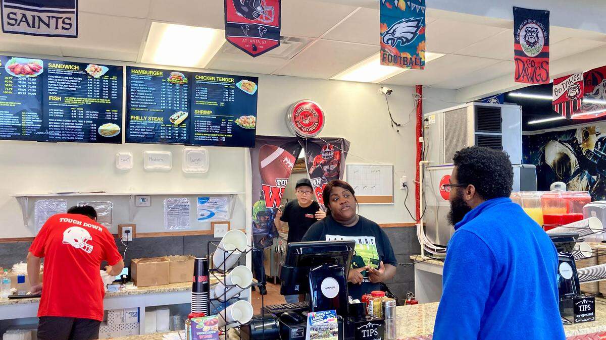 A customer places an order at this new Warner Robins location of this fast-growing restaurant chain known for its all natural organic chicken, 30 sauce flavors and host of other offerings such as Philly steak, hamburgers, fish and fried rice.