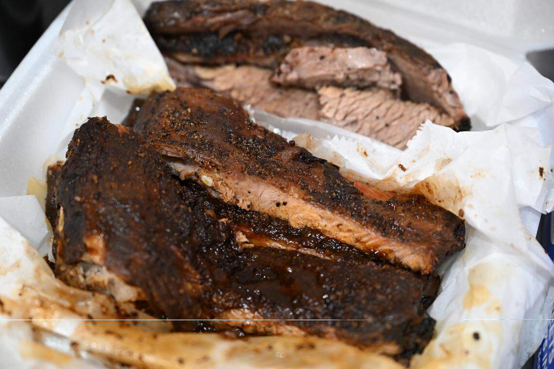 Homemade smoked ribs from J Walker Brisket Company sit inside of “The J Walker Platter” on Thursday, Oct. 23, 2025, in Macon, Georgia. Everything made a J Walker Brisket Co is made in house, down to the barbecue sauce. 