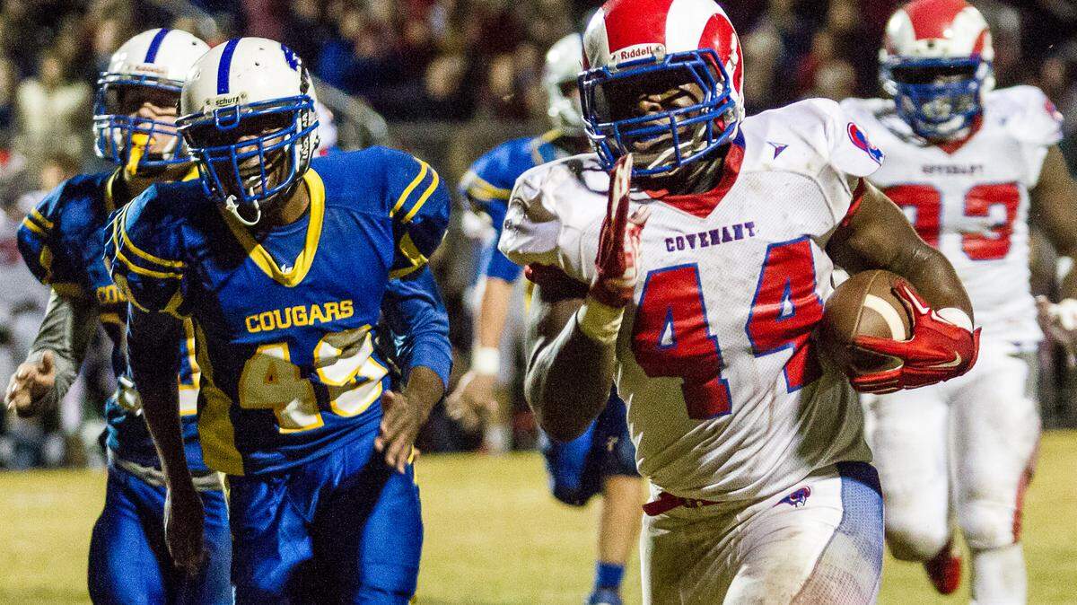 Covenant Khristian Tate breaks free for a long gain in the 1st half of the GICAA Division I-AA championship game against Creekside Friday night.