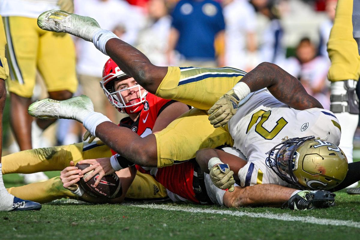 Georgia quarterback Stetson Bennett looks to the official after crossing the goal line. The play was reviewed and ruled it was not a touchdown.