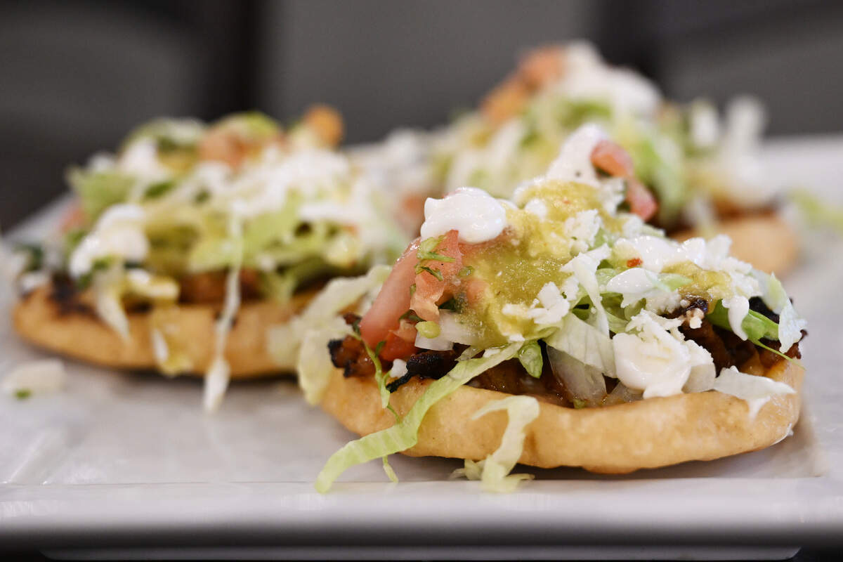 Three deep fried sopes on a plate inside of Fuego Fresco Mexican Restaurant on Thursday, Aug. 28, 2025, in Perry, Georgia. The sopes are topped with beans, meat, lettuce, sour cream, pico de gallo and cheese.