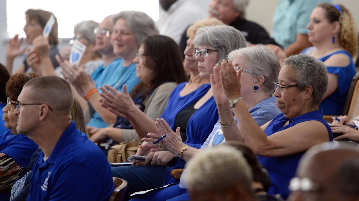Library employees and supporters react to the Macon-Bibb County Commission passing funding that would enable the system to resume normal services by Aug. 27.  In addition to the emergency measure, commissioners passed a millage rate of 20.652, 3 mils higher than last year.