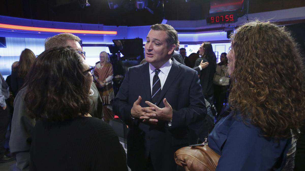 U.S. Sen. Ted Cruz, R-Texas, center, visits with guests following a debate for the Texas U.S. Senate with U.S. Rep. Beto O’Rourke, D-Texas, on Tuesday in San Antonio. A win by Cruz would go a long way in helping the GOP retain control of the U.S. Senate.