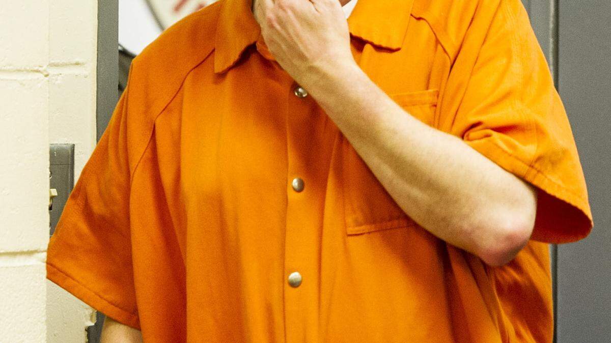 WOODY MARSHALL/THE TELEGRAPH 
 Macon, Georgia, 11/1 1/2015: 
 Charles Woodall, 34, walks into court Wednesday. Bond was denied Wednesday for the former GBI agent accused of molesting three Macon boys.