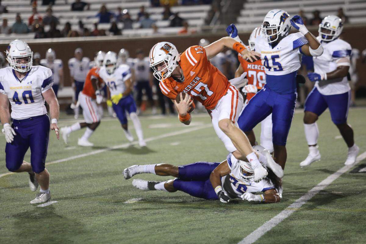 Mercer’s Daniel Shoch breaks a tackle against Morehead State Saturday at Five Star Stadium. The Bears set a school record for yards in a game during their 63-13 win.