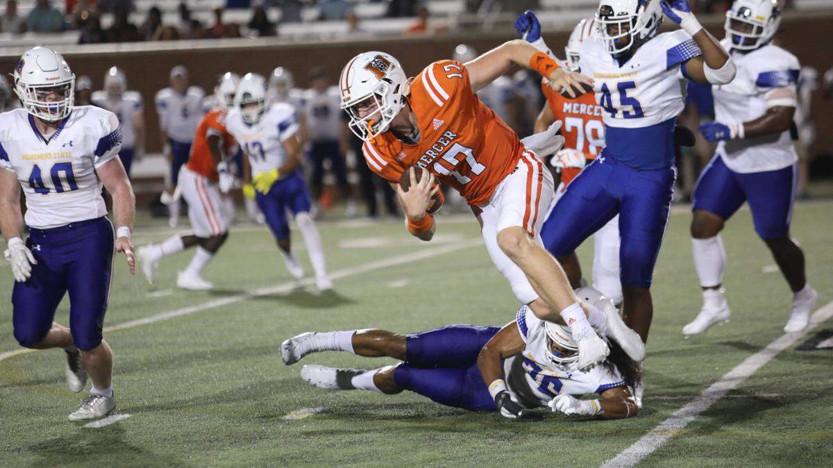 Mercer’s Daniel Shoch breaks a tackle against Morehead State Saturday at Five Star Stadium. The Bears set a school record for yards in a game during their 63-13 win.