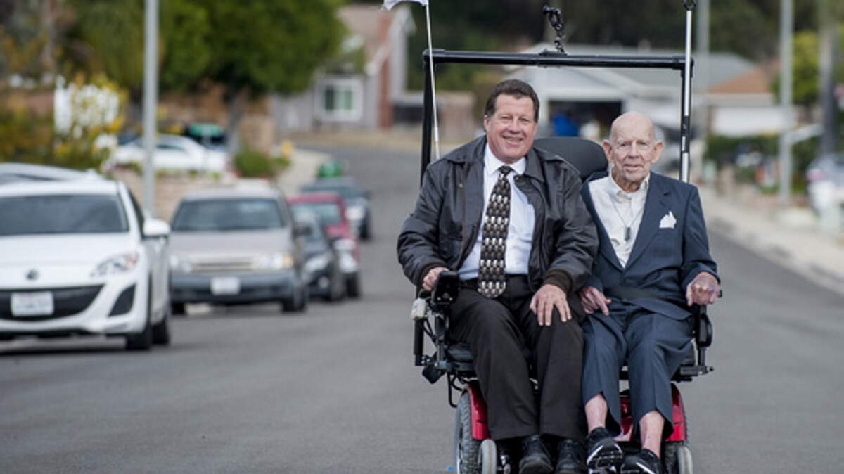 MICHAEL GOULDING/ORANGE COUNTY REGISTERChaplain Roger Rustad and Navy veteran Alvin Butcher, 88, enjoy a drive on an oversized wheelchair they were riding in Mission Viejo, California, on Jan. 4.