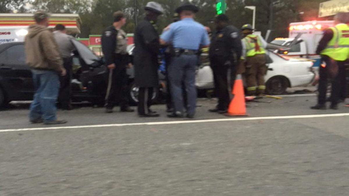 Authorities work the scene of a fatal wreck in south Macon on Monday.