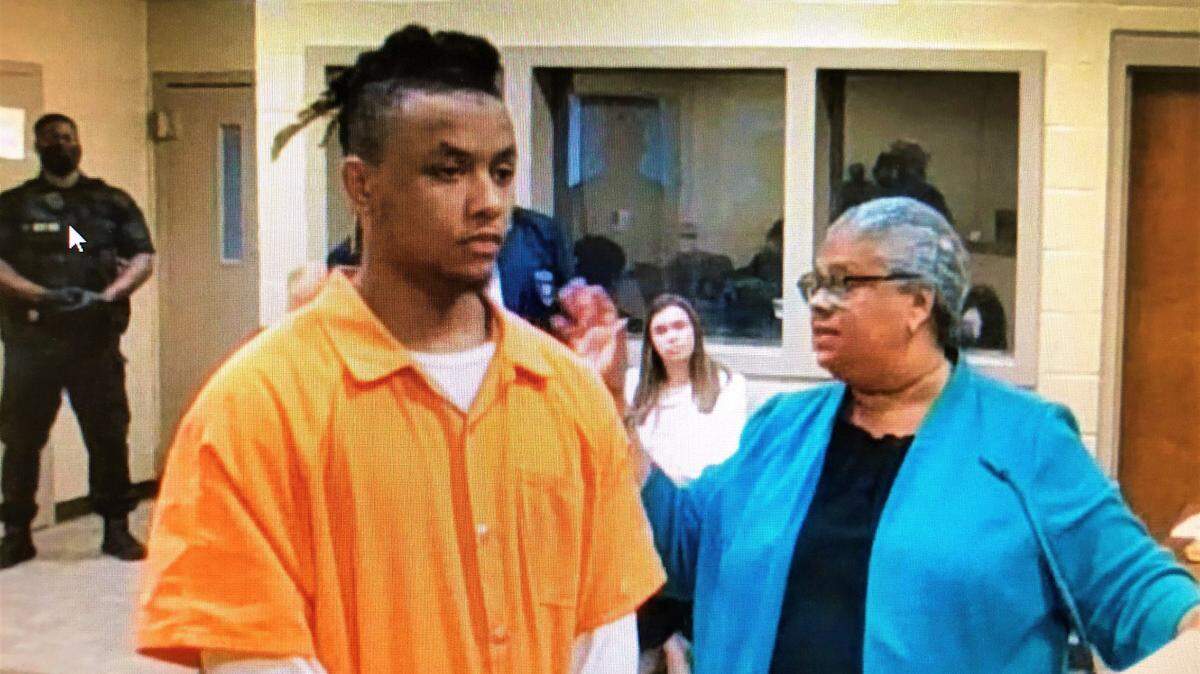 Jamarius Khalil Dixon, left, at a bond hearing in the Bibb County jail on Thursday, June 30, 2022, with his attorney, Debra Gomez.