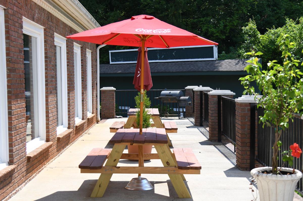 Picnic tables sit on the patio of Zavala at Barrington on Monday, June 17, 2024, in Macon, Georgia. Zavala began as a local catering business and moved to its Barrington Hall location in February, where renovations are ongoing in the club.